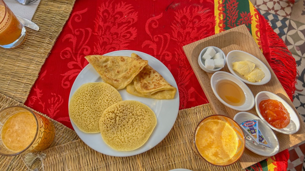 traditional moroccan breakfast of msemen and baghrir in hostel dar ben youssef